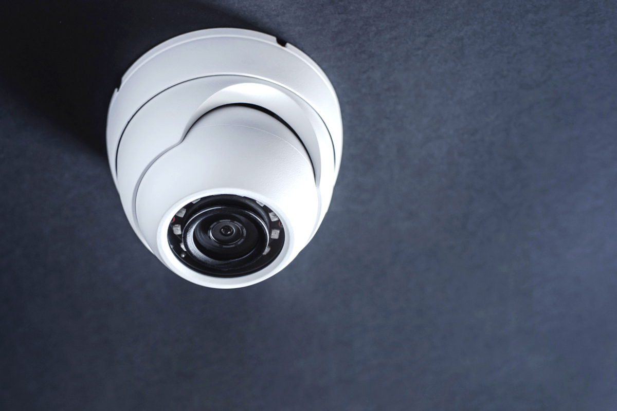 Dome security camera installed in ceiling of home